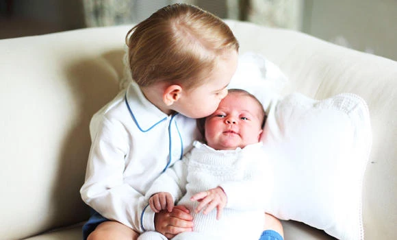 Kiss from big brother in pics of royal baby