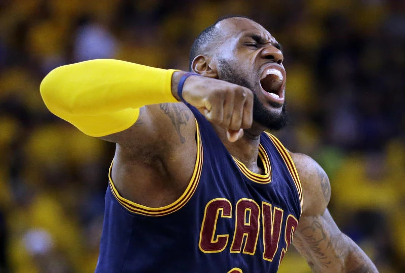 James triple-double lifts Cavs to OT victory over Warriors