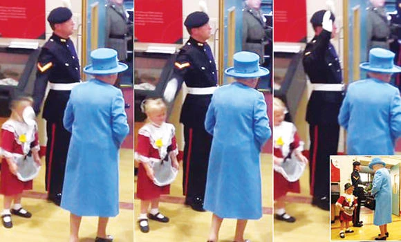 Little girl hit by soldier saluting British queen