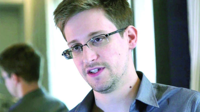 Britain pulls out spies as Russia, China crack Snowden files