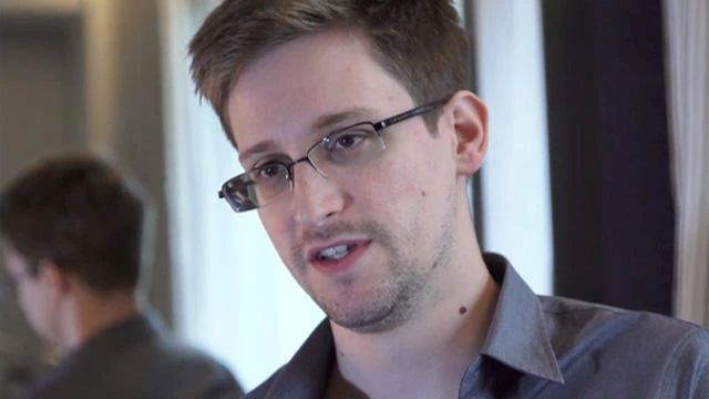 Britain pulls out spies as Russia, China crack Snowden files