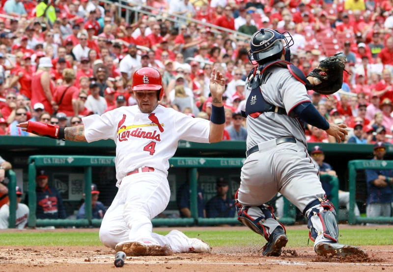 Cardinals play through rain, beat Twins again