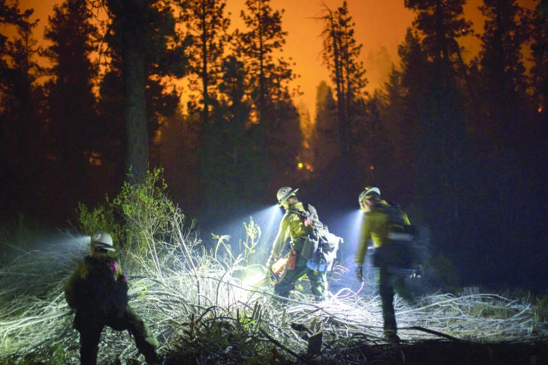 Firefighters battle massive blazes in 3 US states