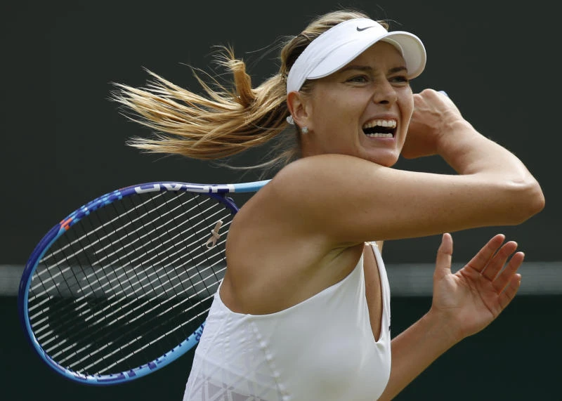 Djokovic, Sharapova waltz into last 16