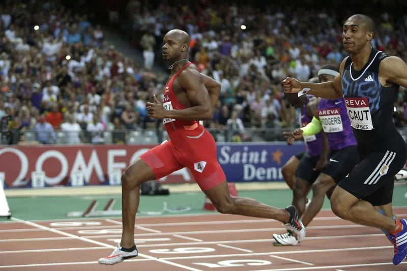 Powell wins in Paris with his fastest 100 in four years