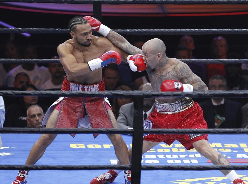 Thurman defends title, calls out Mayweather