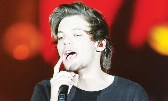 1D’s Tomlinson to be father