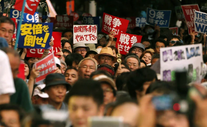 Chaos in Japan parliament as defense bill sparks uproar