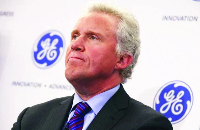 GE reports loss, presses on for Alstom, Electrolux deals