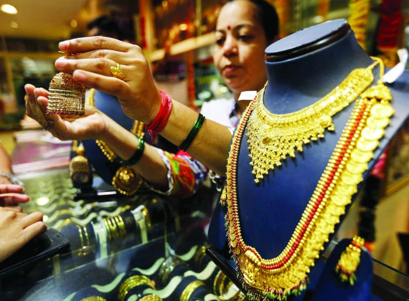 Gold teeters near 5-year low, more losses expected
