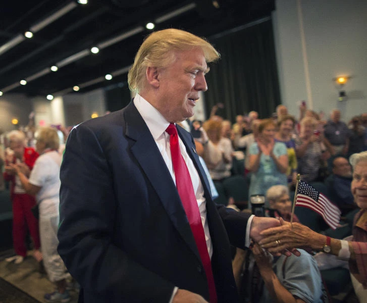 Trump holds up rival’s phone number after criticism