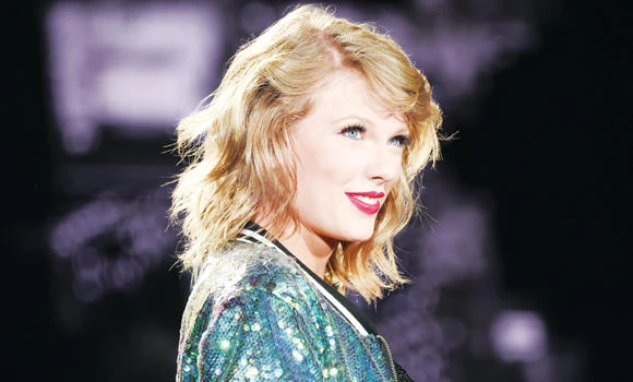 Swift revises photo rules after criticism