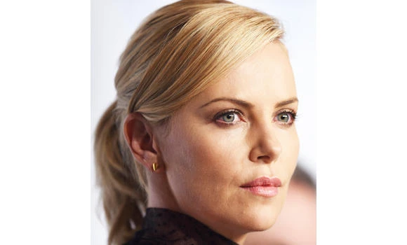 Theron adopts baby girl ‘August’