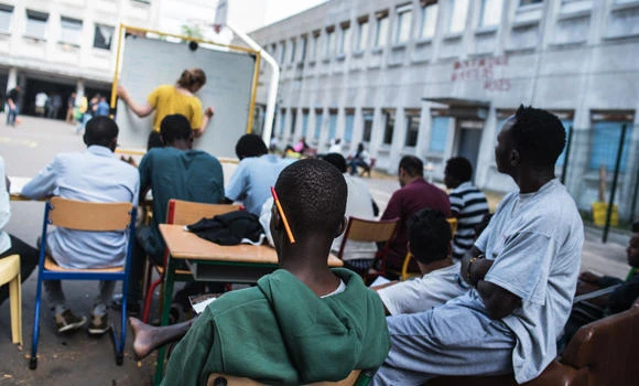 Paris turning schools, hotels into housing for migrants