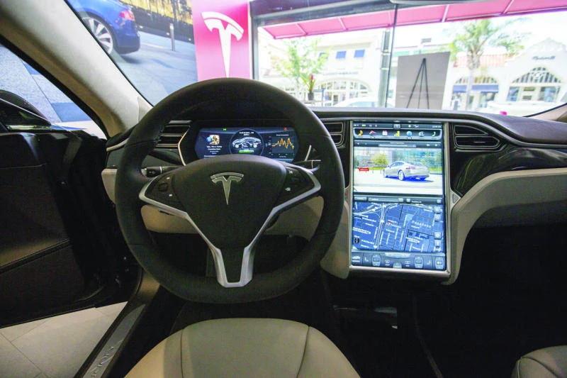 Tesla courts hackers to defend high-tech cars