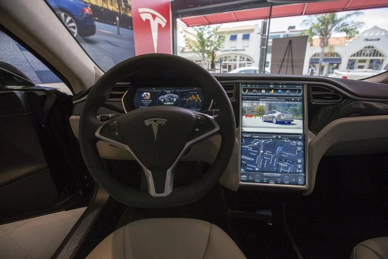 Tesla courts hackers to defend high-tech cars