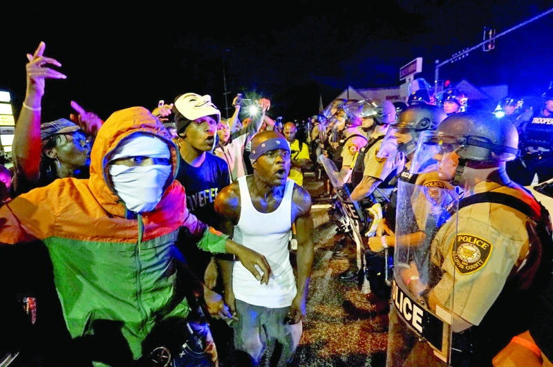 Ferguson police shoot gunman on anniversary of teen killing