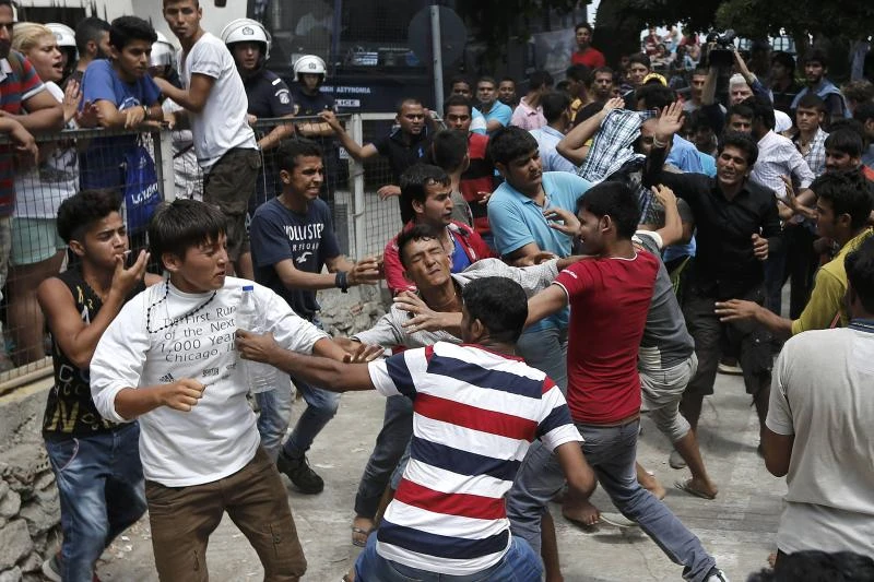 Brawl on Greek island as refugee ship lies empty