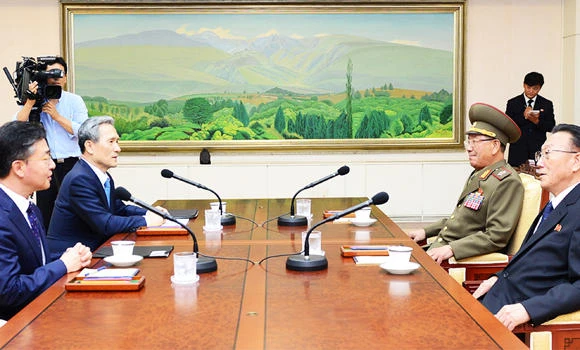 Rival Koreas hold high-level talks in bid to ease tension