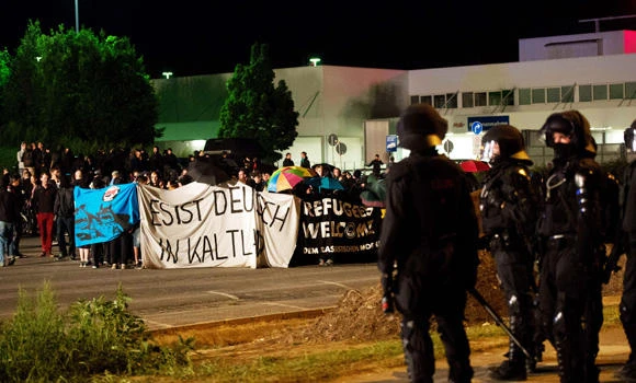 Germany vows to fight xenophobia after attacks on refugee home