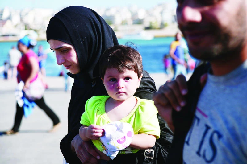 Germany eases asylum rules for Syrians; thousands more pour in