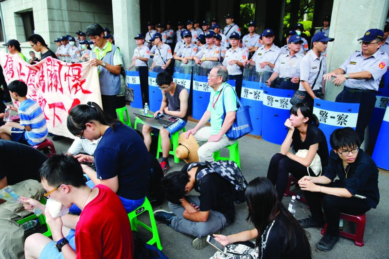 Taiwan protesters vow to escalate action over student suicide