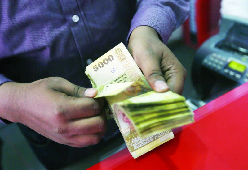 Sri Lanka rupee falls 3% to record low