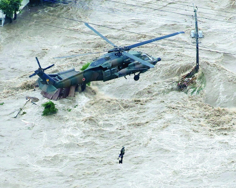 Helicopters pluck residents to safety as rains lash Japan