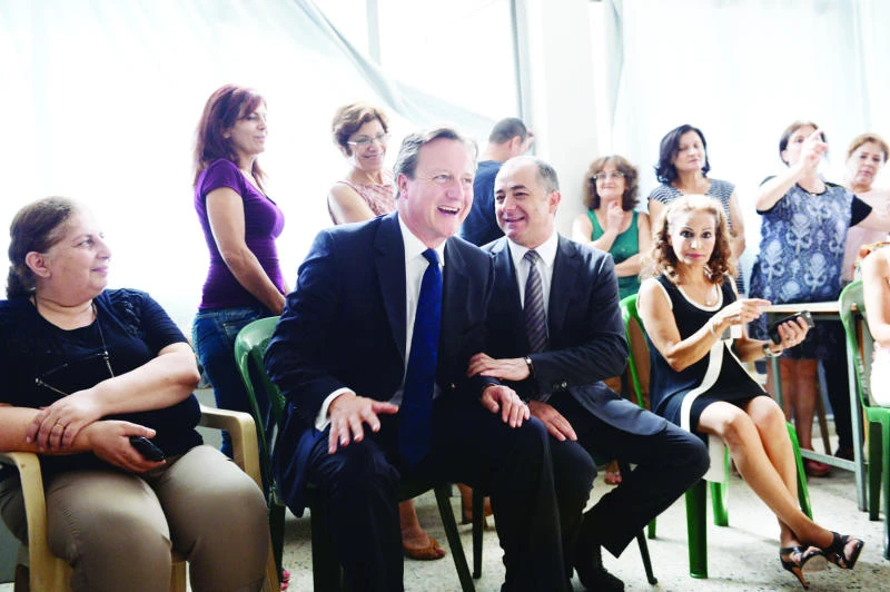 Cameron vows more aid for Syrian refugees, visits camps