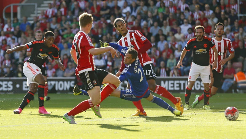 Martial sends Man Utd second; Liverpool held at home
