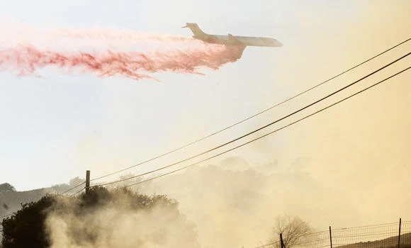 California firefighters struggle to control blazes