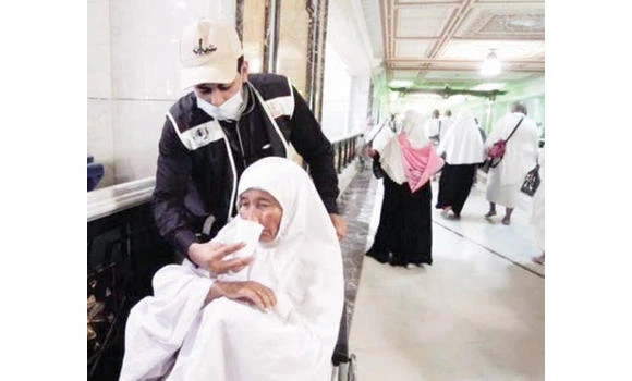 Youth work as volunteers to help pilgrims in Makkah