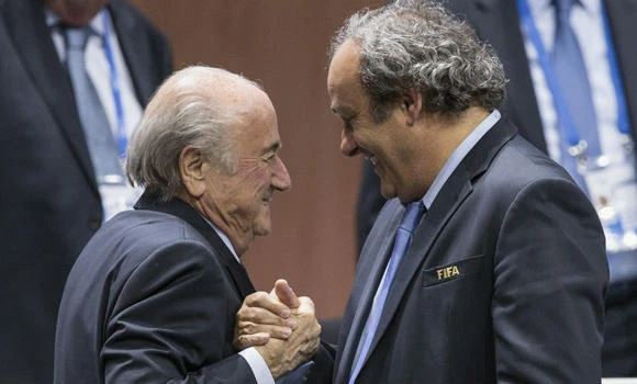 FIFA chief Blatter urged to step down, faces criminal probe