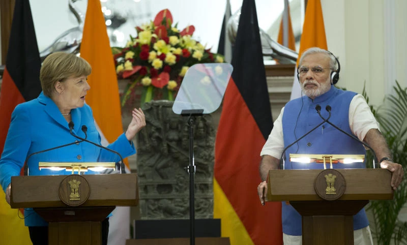 Modi and Merkel agree to fast-track business deals in India