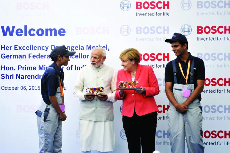 Modi promises German firms tax reforms as Merkel visits