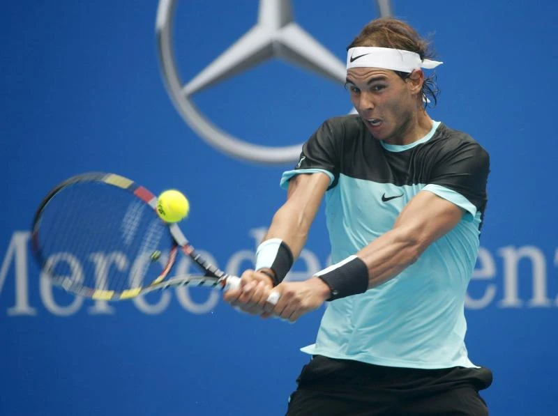 Nadal struggles against ex-ball boy, Djokovic on fire