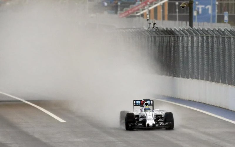Massa tops times in forlorn rain-hit practice