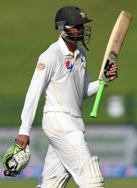 England fights after Malik double century