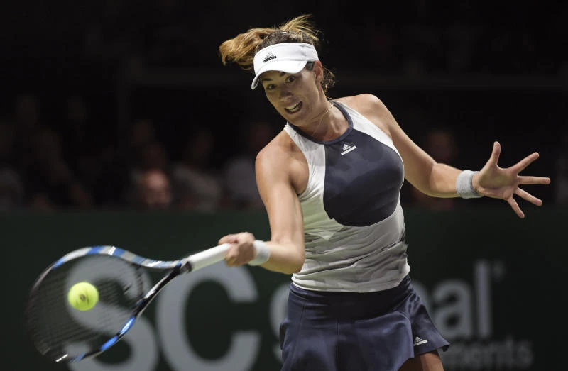 Muguruza muscles way to verge of WTA semis