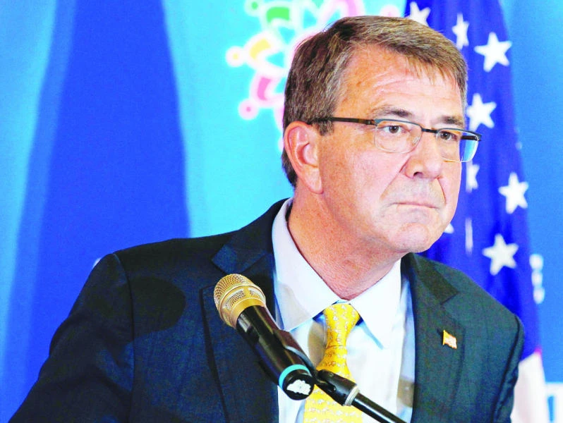 US defense secretary visits carrier in disputed waterway