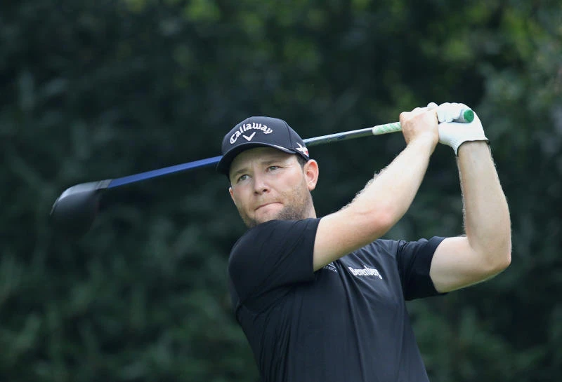 Grace leads WGC in China as McIlroy guts it out