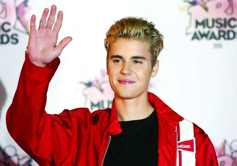 Bieber, One Direction try to grow up on new albums