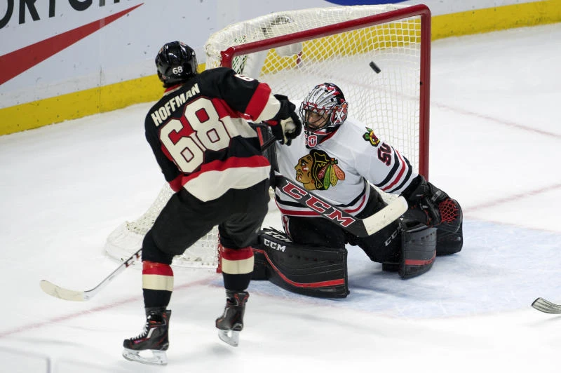Hoffman scores in OT to lift Senators past Blackhawks