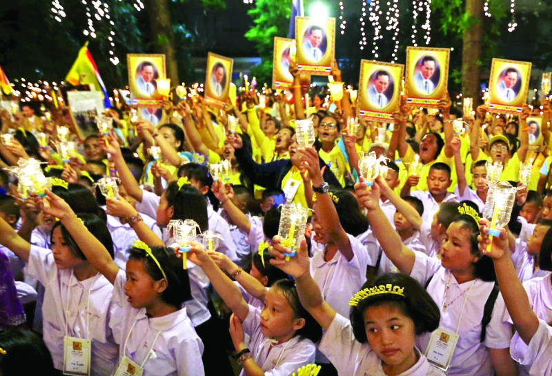 Thai king marks 88th b’day amid widening royal insult probe
