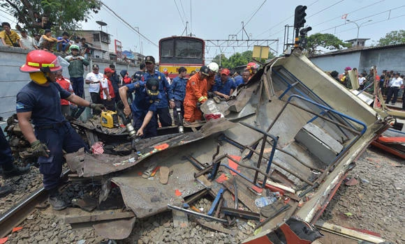 Commuter train hits passenger bus in Indonesia; 14 dead