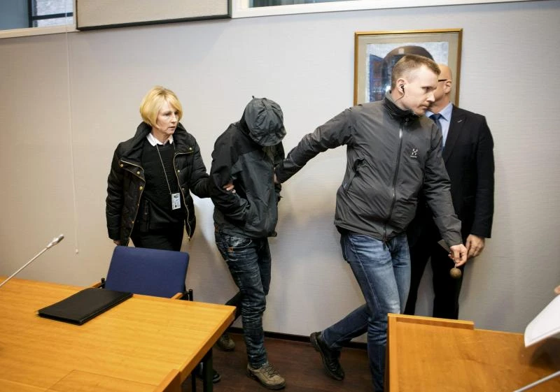 Finnish court to hold twins in custody over Iraq massacre
