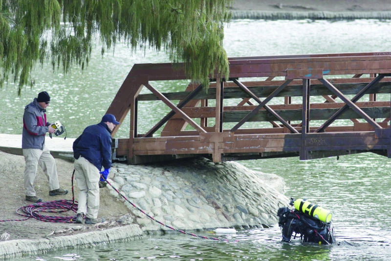 Divers retrieve more items in search for California shooting clues