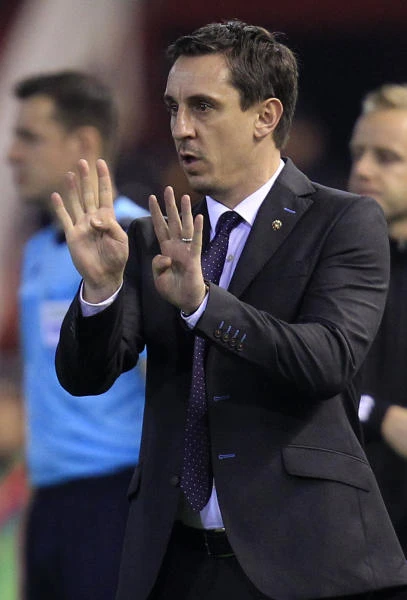 Neville bags first win as Valencia cruises into Cup last 16