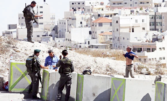 Zionist thugs throw tear gas into Arab home