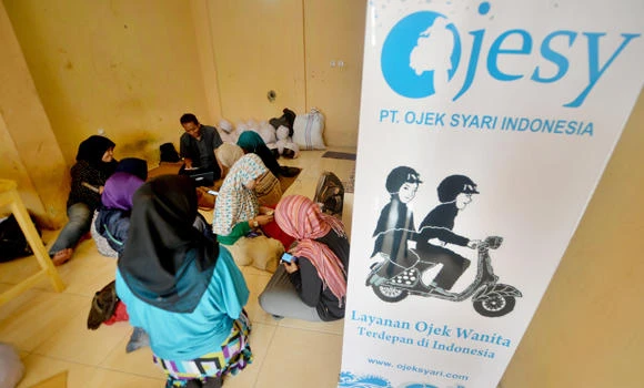 Indonesia's Muslim women hail female-only motorbike taxis